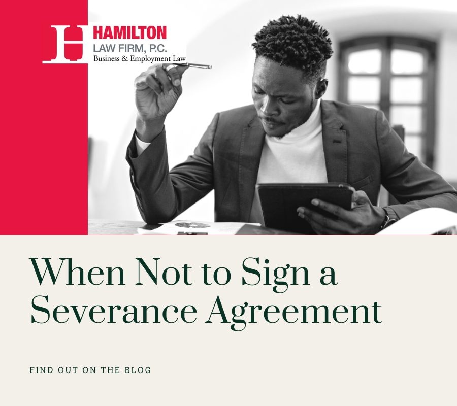 employee at table discussing severance agreement